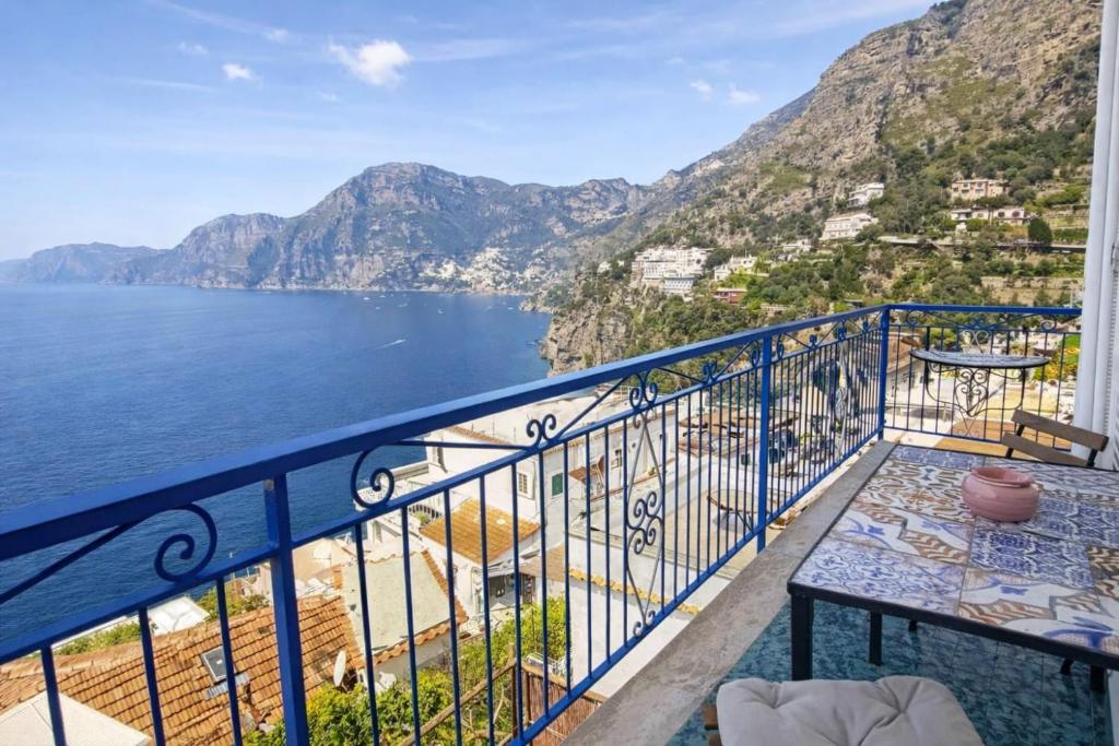 a balcony with a view of the amalfi coast at Panoramic Sea View Balcony Apartment in the Heart of Praiano, Casa Mimì Junior in Praiano