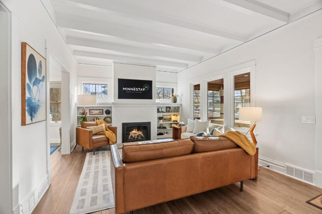 a living room with a couch and a fireplace at Featherstone in White Bear Lake