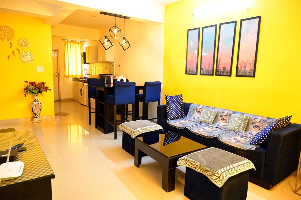 a living room with a couch and a table at Serenity Casa II in Goa
