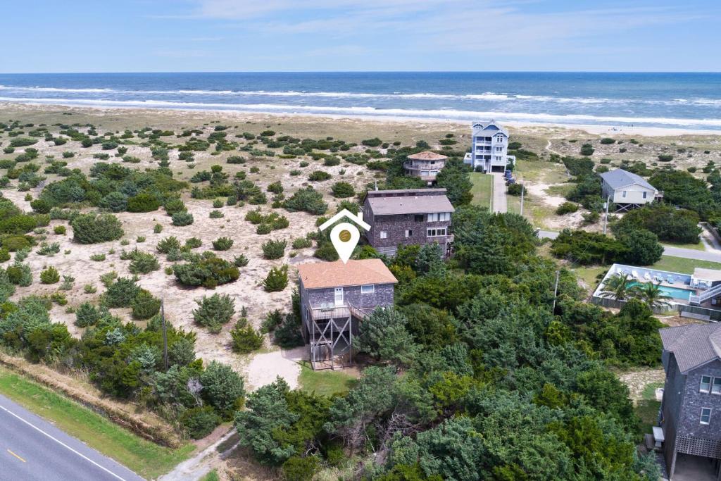 an aerial view of a house on the beach at 7504 - Sunrise-Sunset in Avon