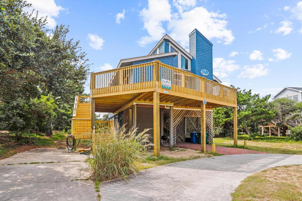 a house with a deck on top of it at 3979 - Wright by the Coast in Duck