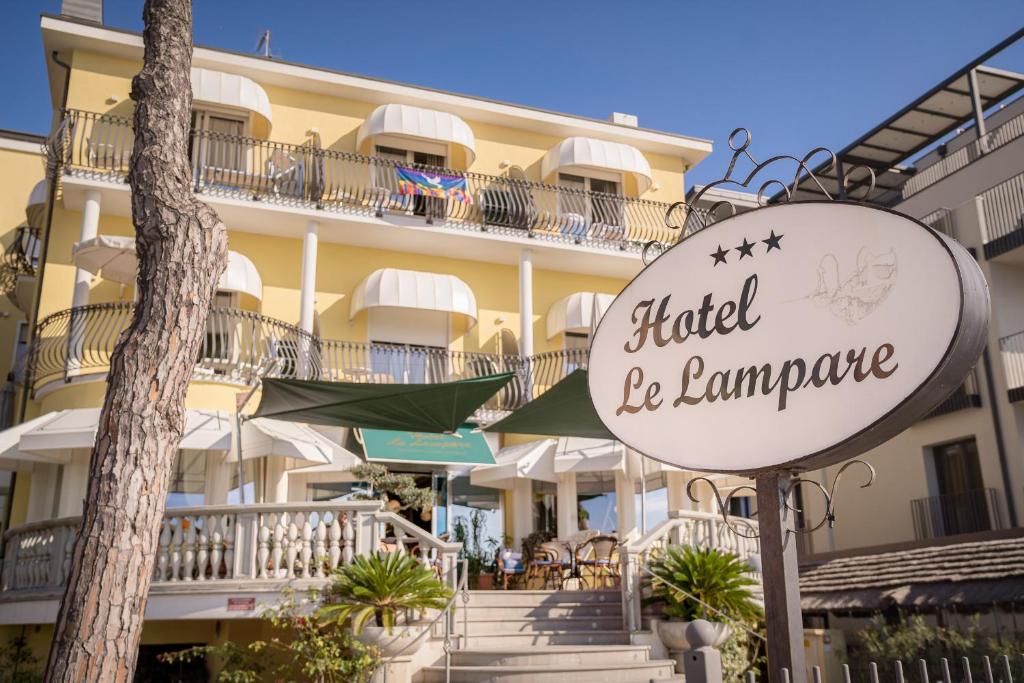 a hotel be ambassador sign in front of a building at Hotel Le Lampare in Caorle
