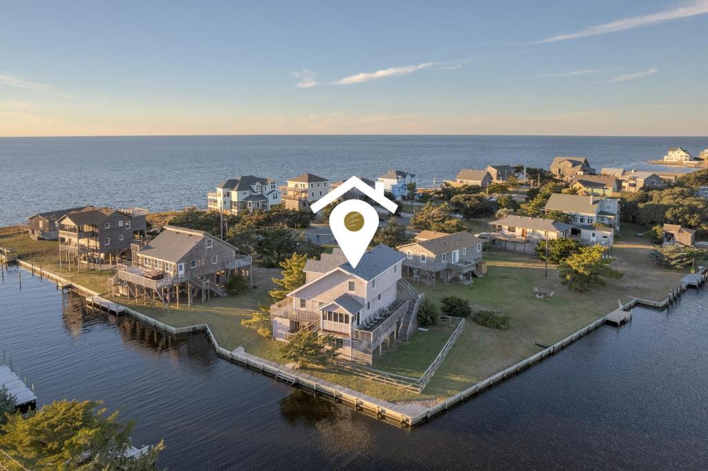 an aerial view of a house on the water at 7657 - Dragon's Lair in Avon
