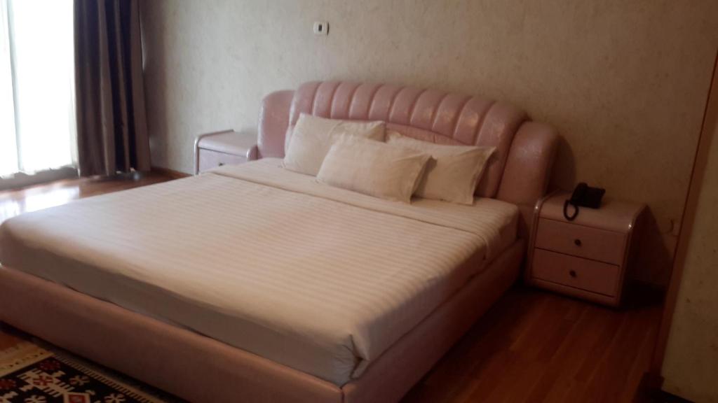 Llit o llits en una habitació de Impress Hotel