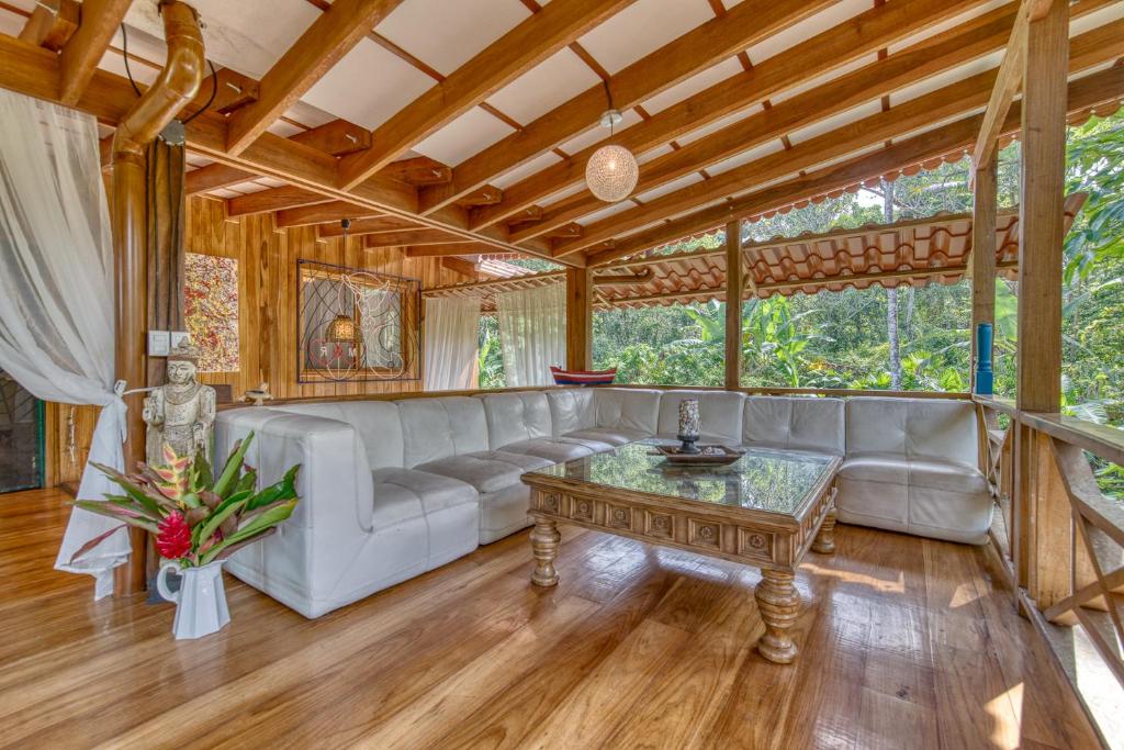 a living room with a couch and a table at Apartment by the Caribbean sea in Cahuita