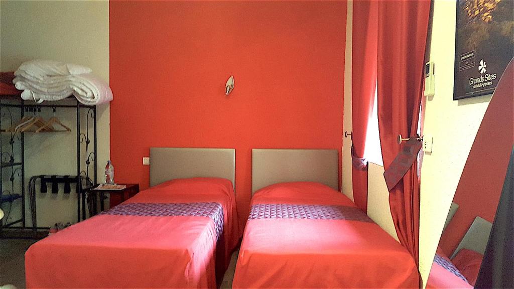 Postel nebo postele na pokoji v ubytování Hotel Le Gambetta