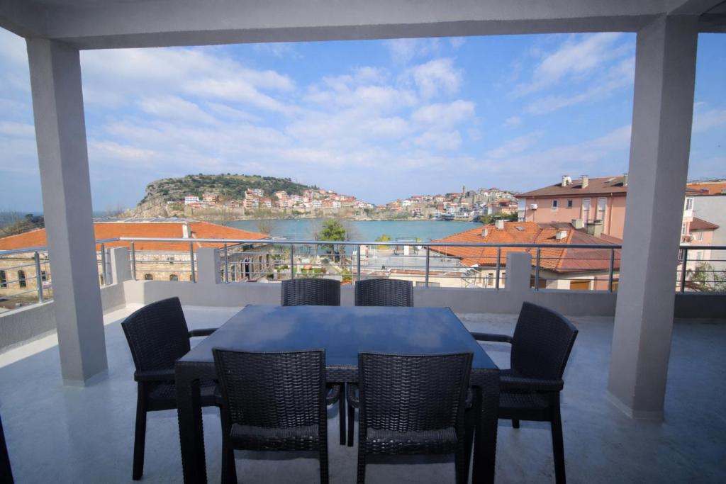 a table and chairs on a balcony with a view at Amasra Kerem Apart in Amasra