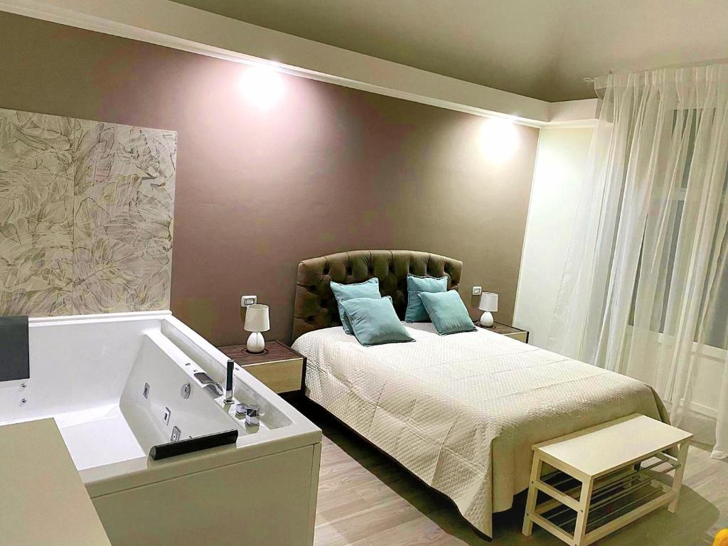 a small bedroom with a bed and a sink at Due Delfini in Taranto