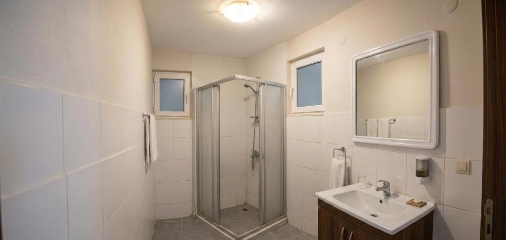 a bathroom with a shower and a sink at Rasim otl in Göksun