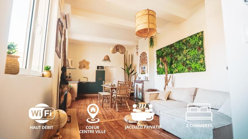 a living room with a couch and a table at L Escale Balinaise et Spa #7 in Agen