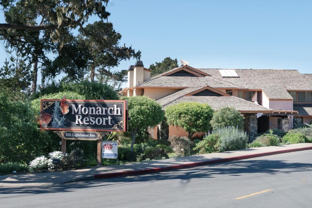 a sign for a mountain resort in front of a house at The Monarch Resort in Pacific Grove
