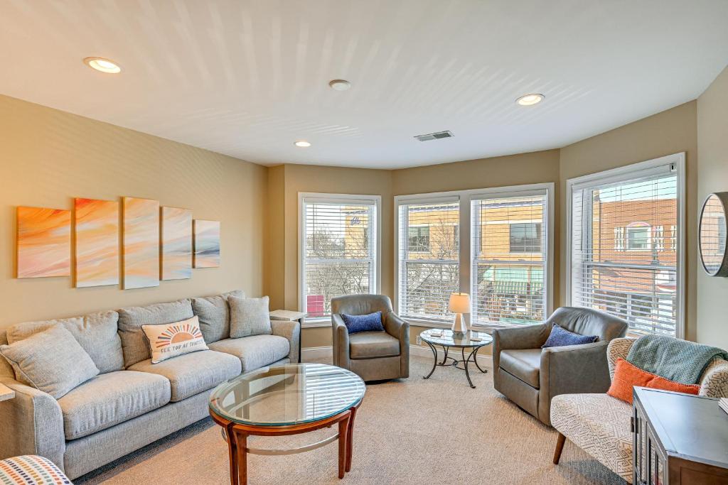 a living room with a couch and chairs and a table at 'Phoenix Nest' South Haven Condo: River View! in South Haven