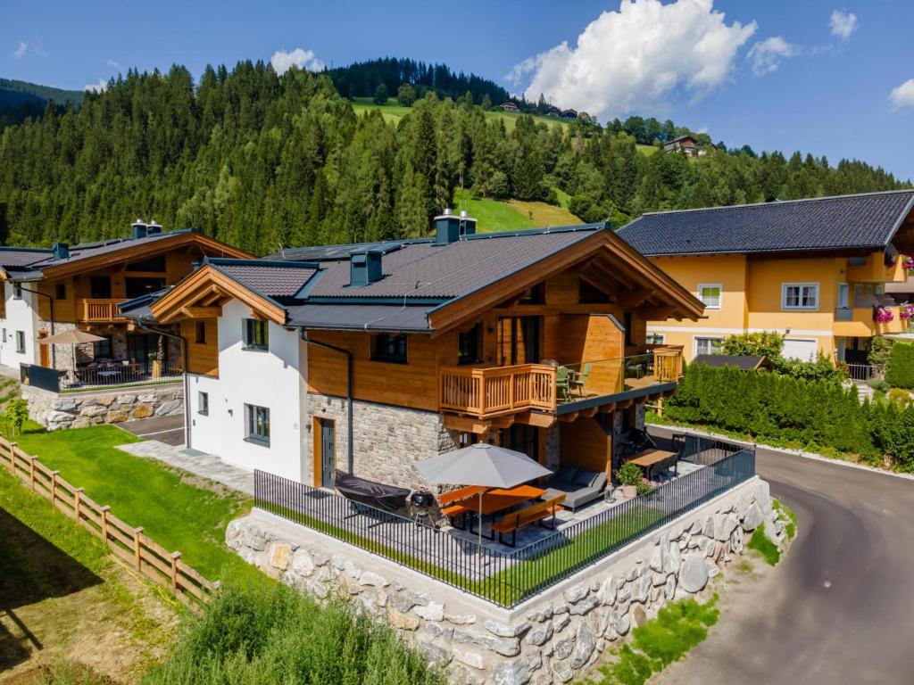 an aerial view of a house with a patio and a house at Wagrainer TauernLodge 42C in Wagrain