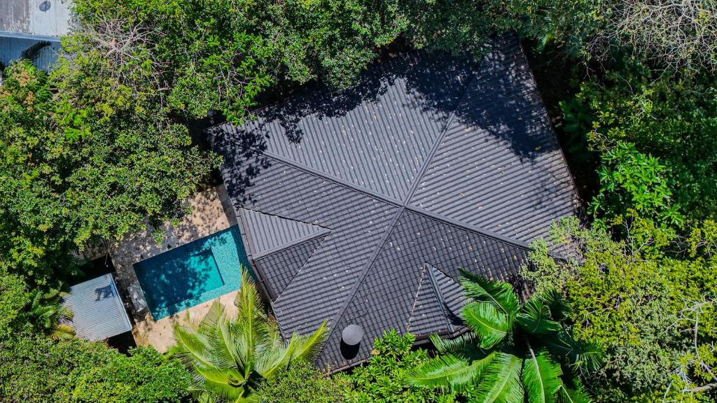 an overhead view of a garden with a swimming pool at Casa escondida in Uvita