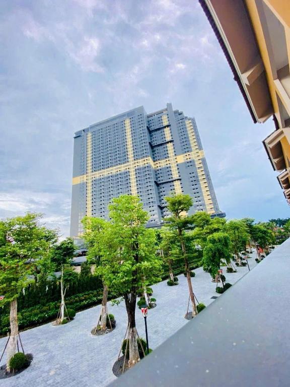 a view of a building with trees in front of it at Lynntime in La Phu