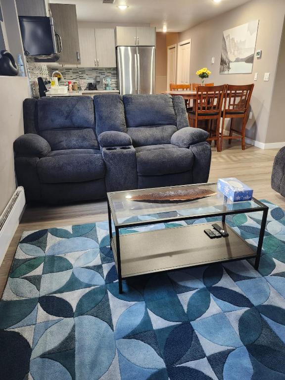a living room with a couch and a table at Stromberg Court in Saskatoon