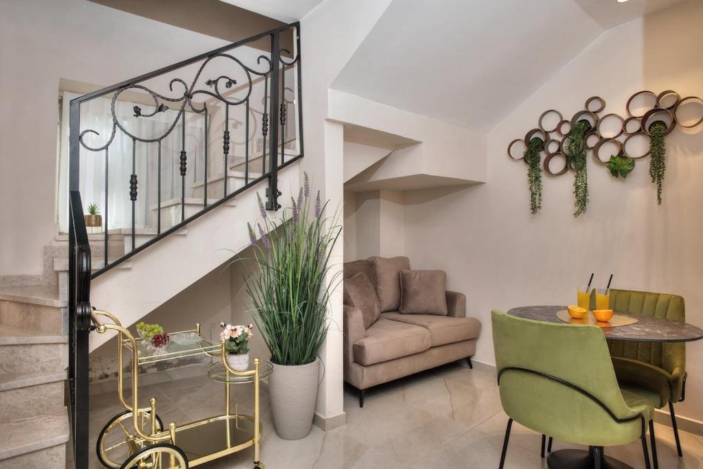 a living room with a table and a couch at סוויטות סוויט - Suite in Safed