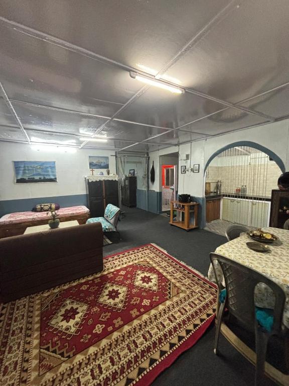 a living room with a couch and a rug at Blue Valley Escape in Darjeeling
