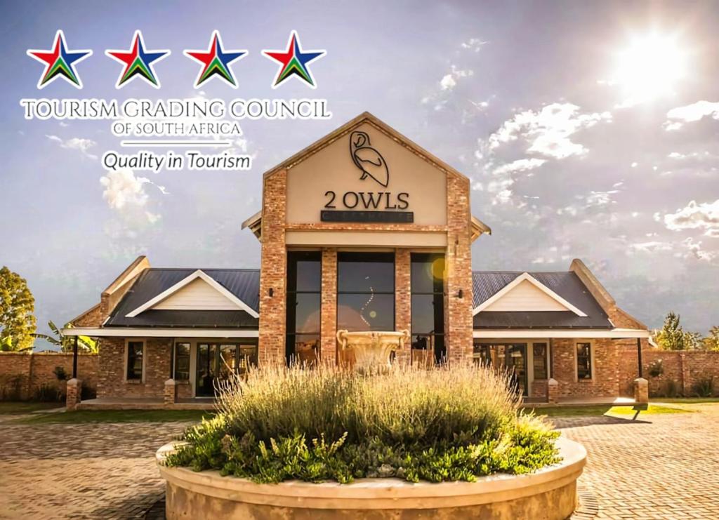 a building with the words tum tum trading council of southern at 2 Owls Guesthouse in Potchefstroom