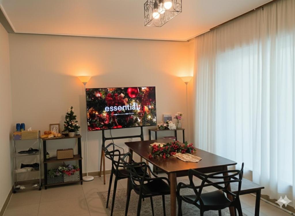 a living room with a table and a tv at 스테이일룸 in Sŭngch'ŏn-ni