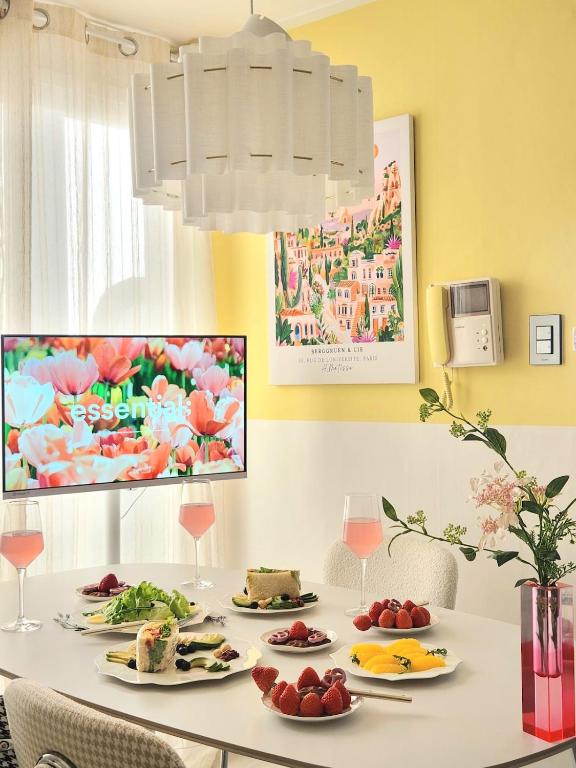 a dining room table with plates of food on it at Mignon Stay FreeParking Near KSPODome AsanMedicalCenter LotteWorldTower in Samgong