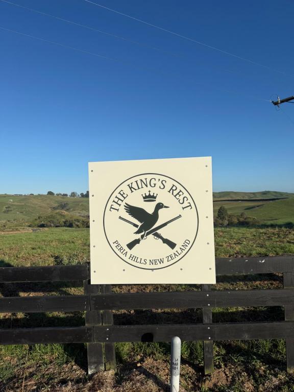 a sign for the kings pavilion in a field at The King's Rest in Matamata