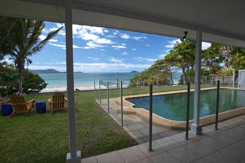 a view of a swimming pool from a house at Tide Pool Ocean Front Full house in South Mission Beach