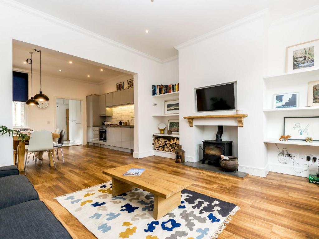 a living room with a couch and a table at Priory Street in York