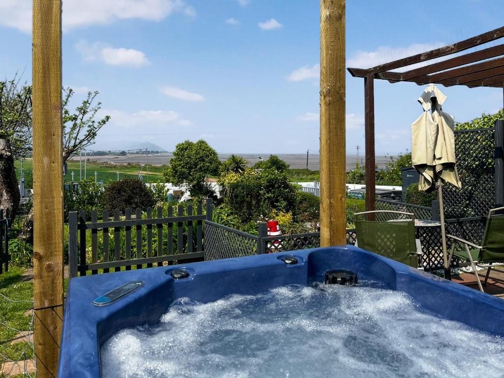 a hot tub in a gazebo at Anchors Away - 29566 in Blue Anchor