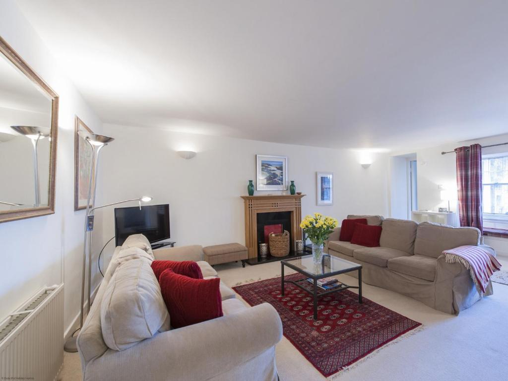 a living room with two couches and a fireplace at 7A - Uk7350 in Edinburgh