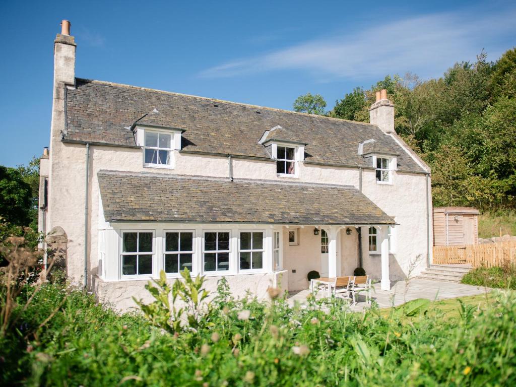a large white house with a roof at East Balnacraig in Banchory
