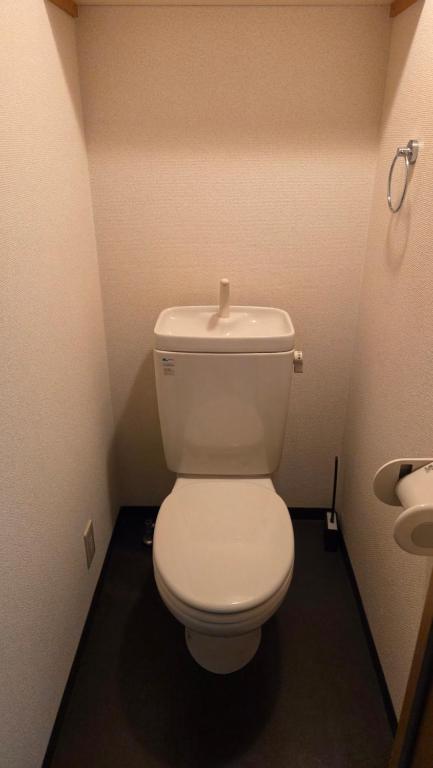 a bathroom with a white toilet in a stall at MORI Apartment Near namba in Osaka