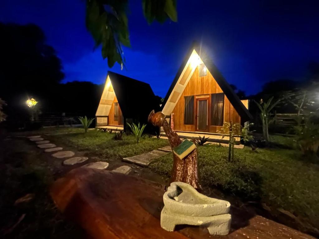 a house with a light on top of it at night at Zalfa Homestay in Taliwang