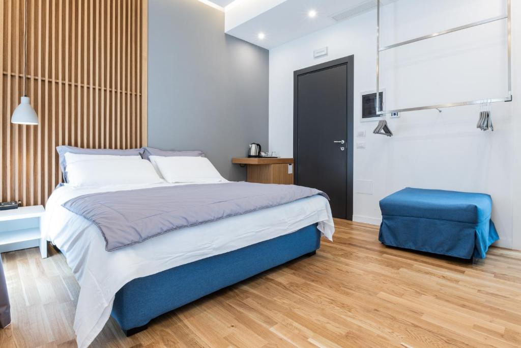 En eller flere senge i et værelse på Concept Terrace Hotel