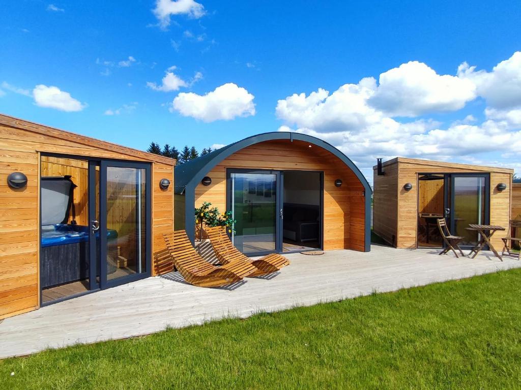a modular house with chairs on a deck at Ben Rinnes - Ukc6028 in Newmill