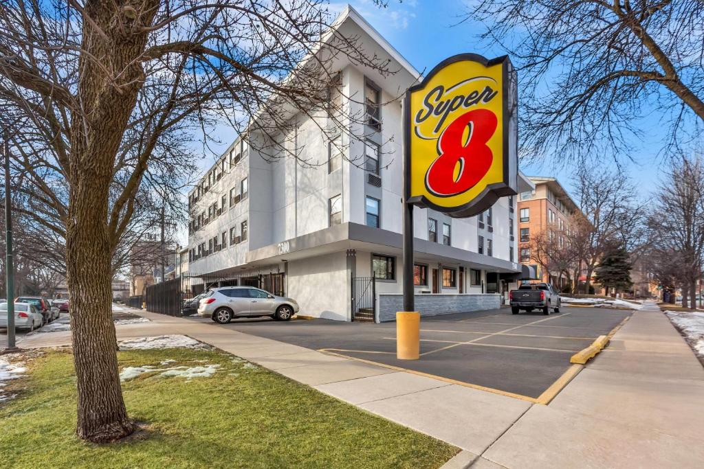 a sign for a super restaurant on a street at Super 8 by Wyndham Chicago IL in Chicago