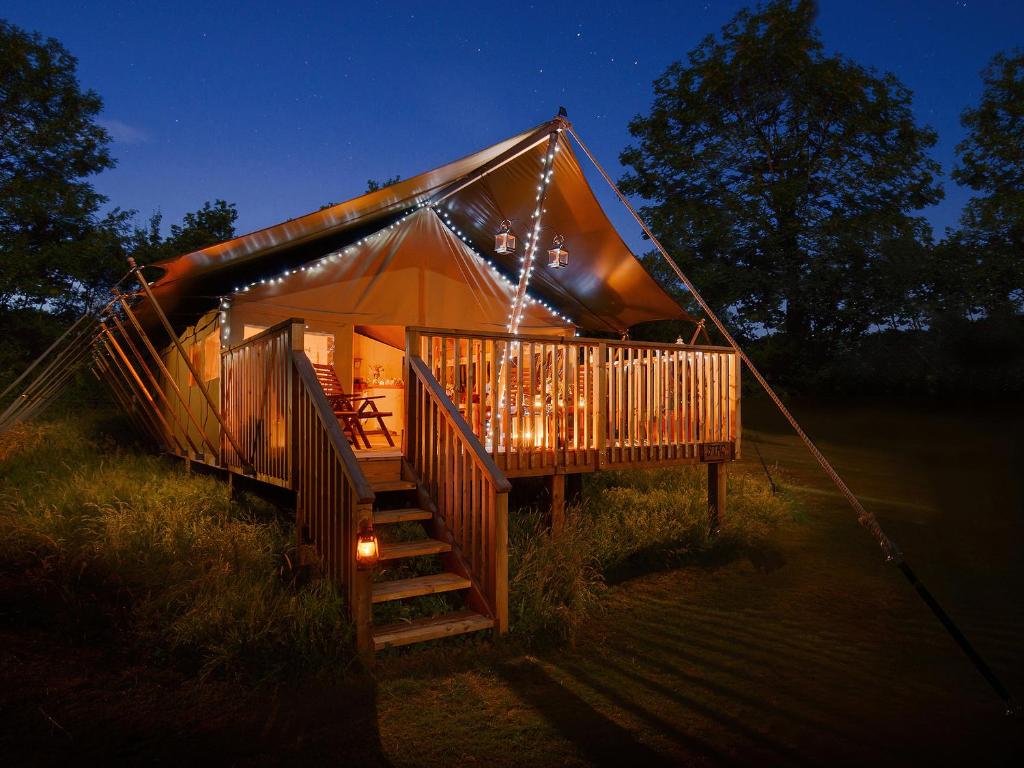 a tent with lights on it in a field at 2 Lower Keat Glamping - Ukc4744 in Chardstock