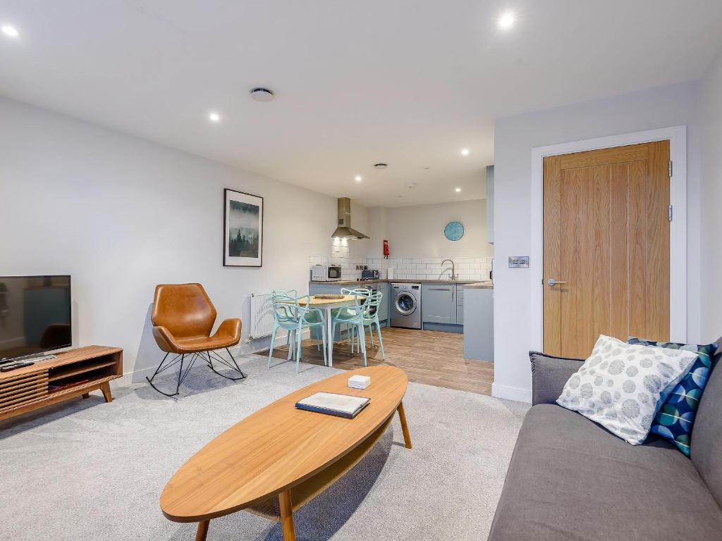 a living room with a couch and a table at 3 Eastgate - Uk34282 in Andover