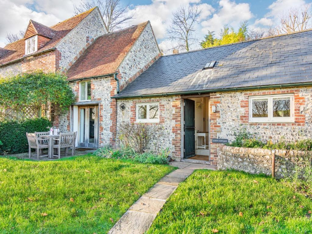 a brick house with a pathway leading to the front door at Giddy Cottage - Ukc6127 in Eastdean