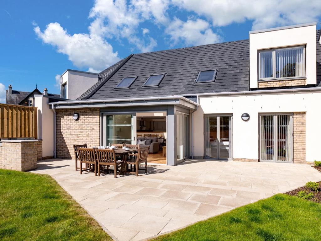 an extension to a house with a patio at Lundin Lodge - Ukc5802 in Lundin Links