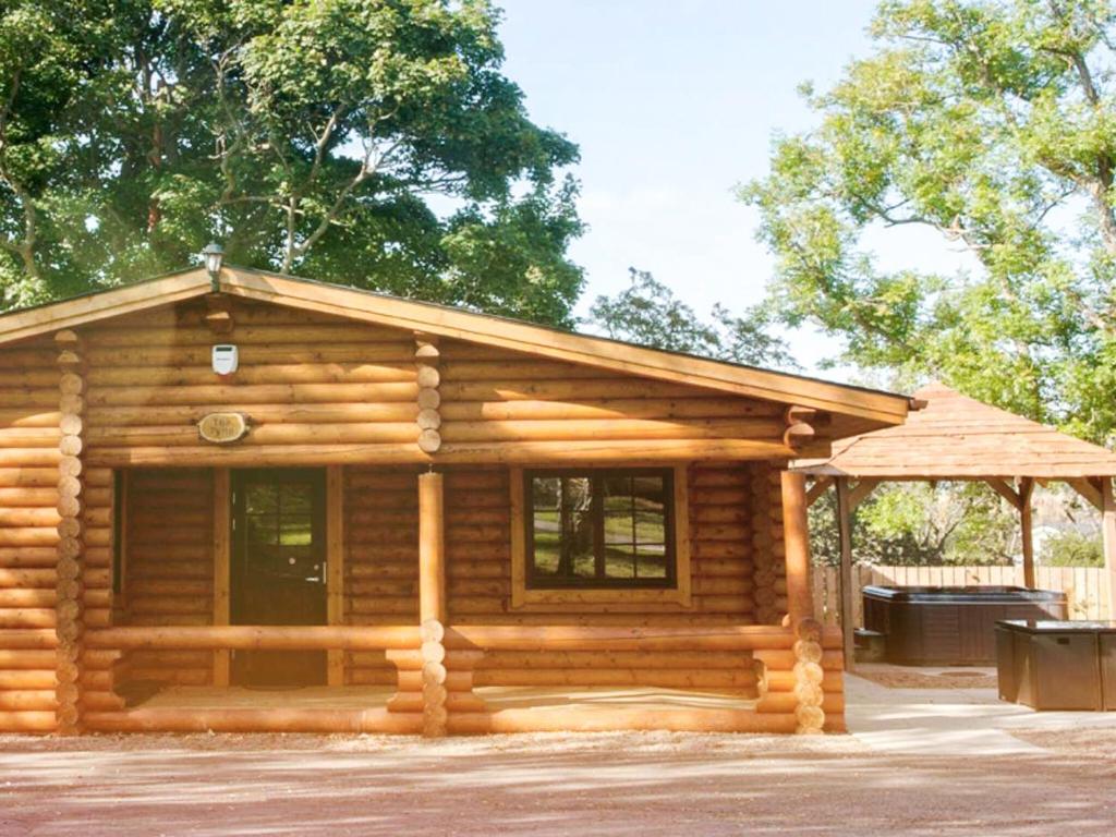 a log cabin with a gazebo at Hadrians Lodge - Uk3478 in West Thirston