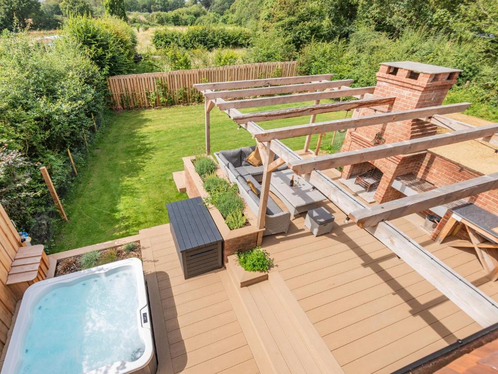 an overhead view of a backyard with a swimming pool at Lucky's Stable - Uk34101 in Chichester