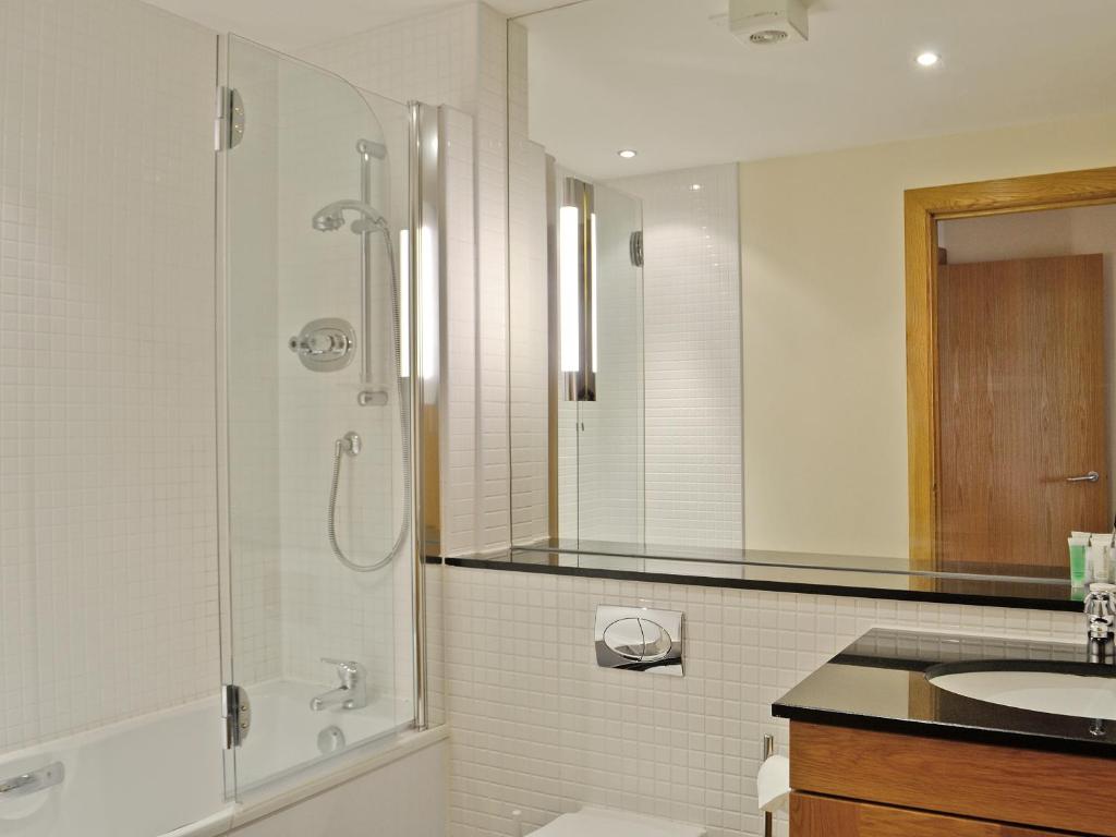 a bathroom with a shower and a sink at Links Apartment 24 - Uk5144 in Brora