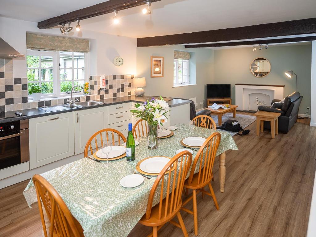a kitchen and dining room with a table and chairs at Number Eight - Ukc4971 in Tawstock