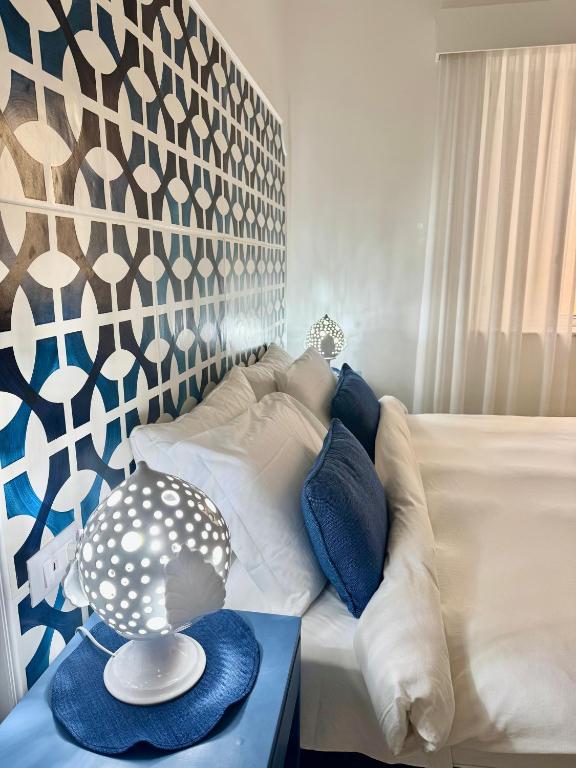 a living room with a white couch and a table at MARILISE - La maison blue private garden & terrace in Meta