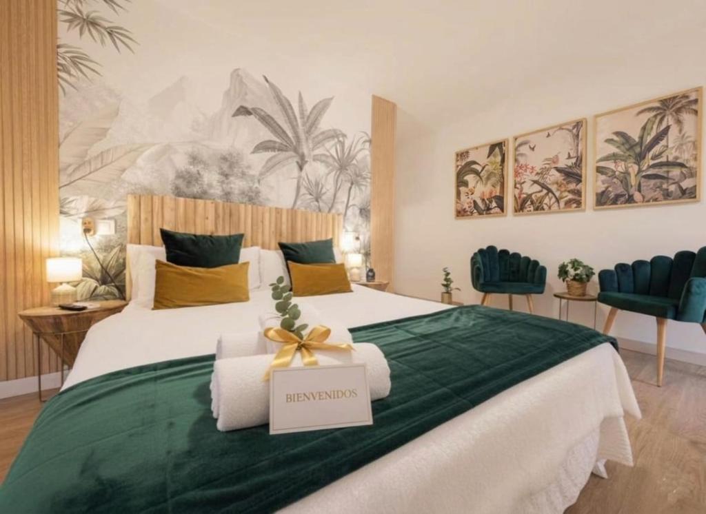 a bedroom with a large bed with a sign on it at Ciudad Rodrigo Centro VuT in Ciudad-Rodrigo