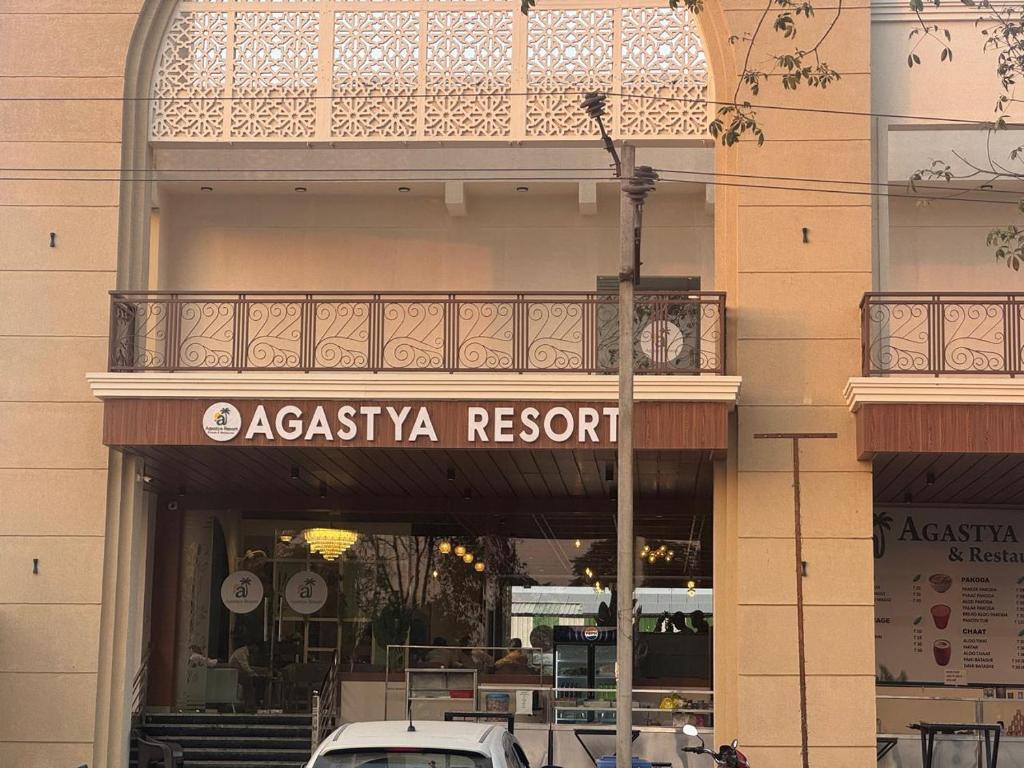 aania resort sign on the side of a building at Agastya Resort in Bāri