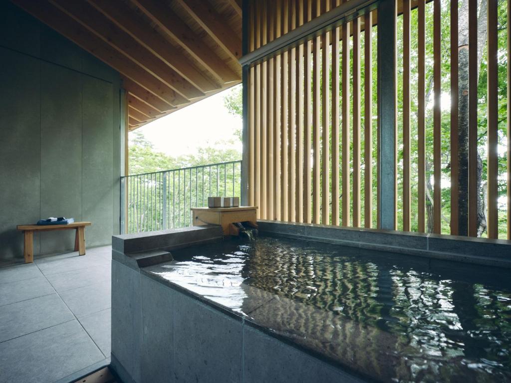 a pool of water in a room with at SANU 2nd Home Nasu 3rd in Nasu