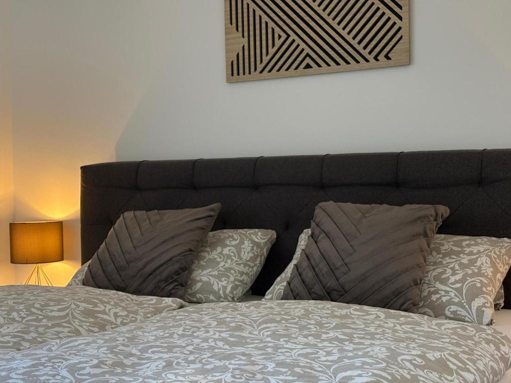 a bed with two pillows on top of it at Ferienwohnung Zaglmann in Zandt
