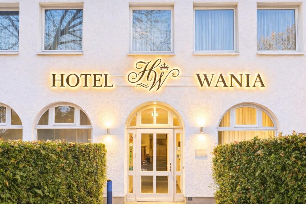 a hotel sign on the side of a building at Hotel Wania in Hamburg